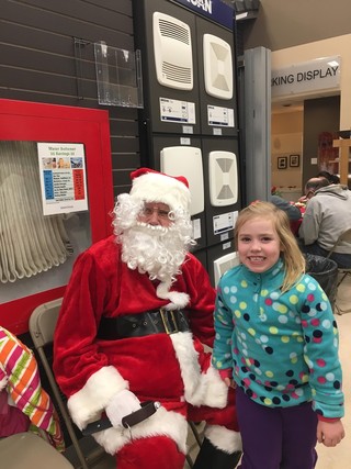 Little girl meeting Santa Dec 15 at Bartle & Gibson
